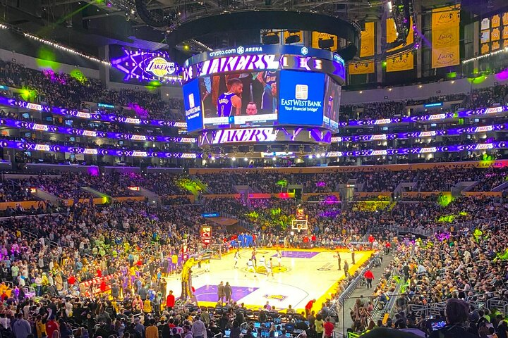 Experience the excitement of a Lakers game at Crypto Arena where basketball history meets modern entertainment. Immerse yourself in the energy of fans and iconic moments.